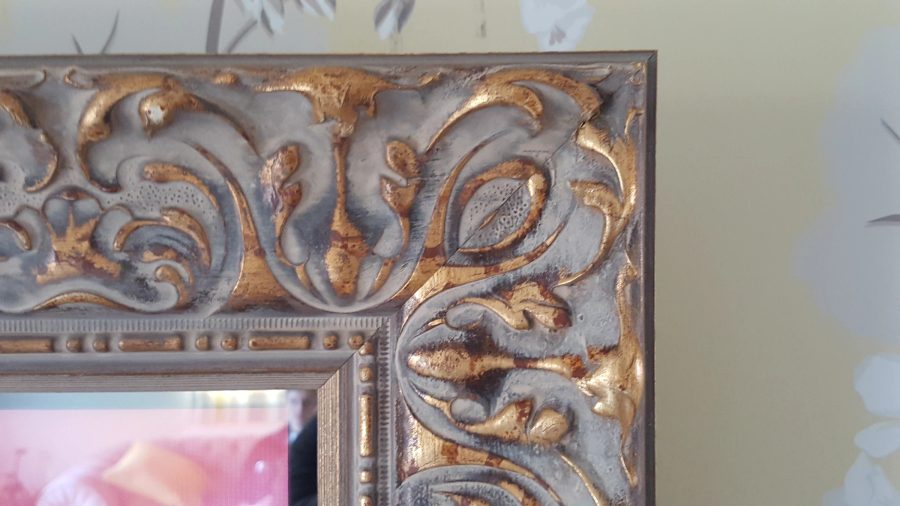 Ornate Gold Living Room Mirror TV — standard wall — detail photograph