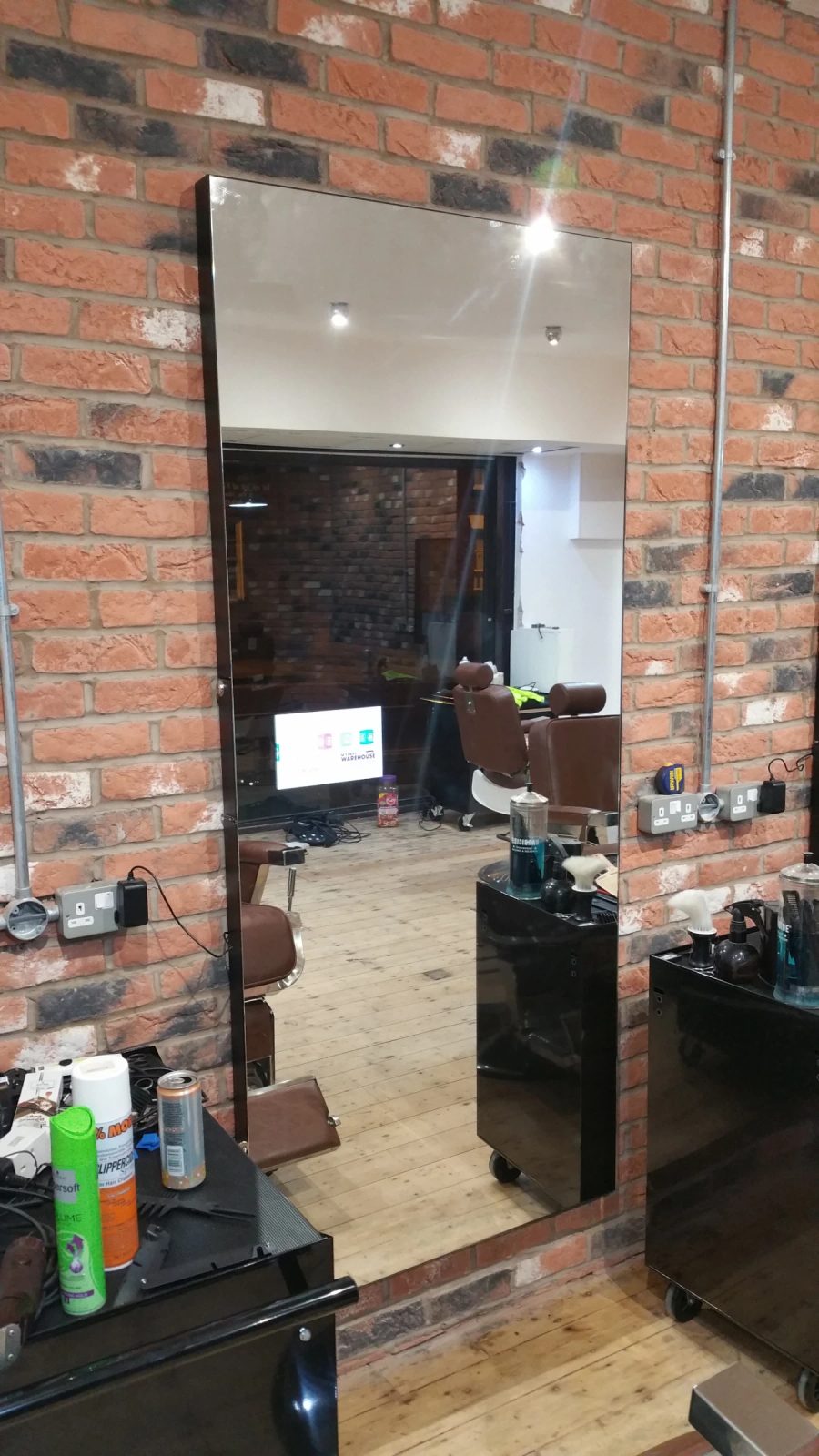 Hair Salon Mirror TV Installation — detail photograph