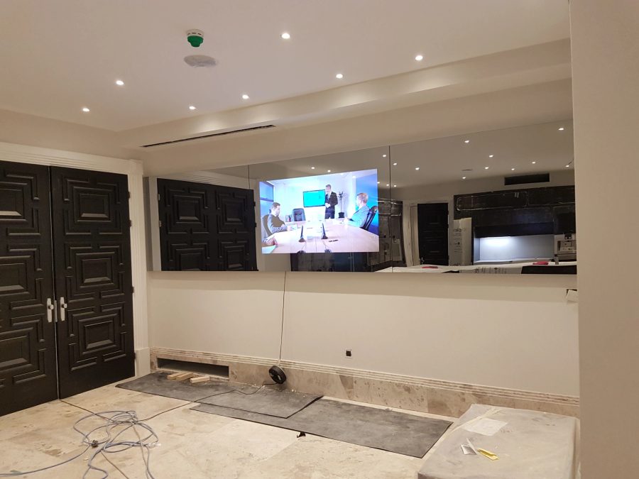 Full-Width Kitchen Mirror TV Wall — detail photograph