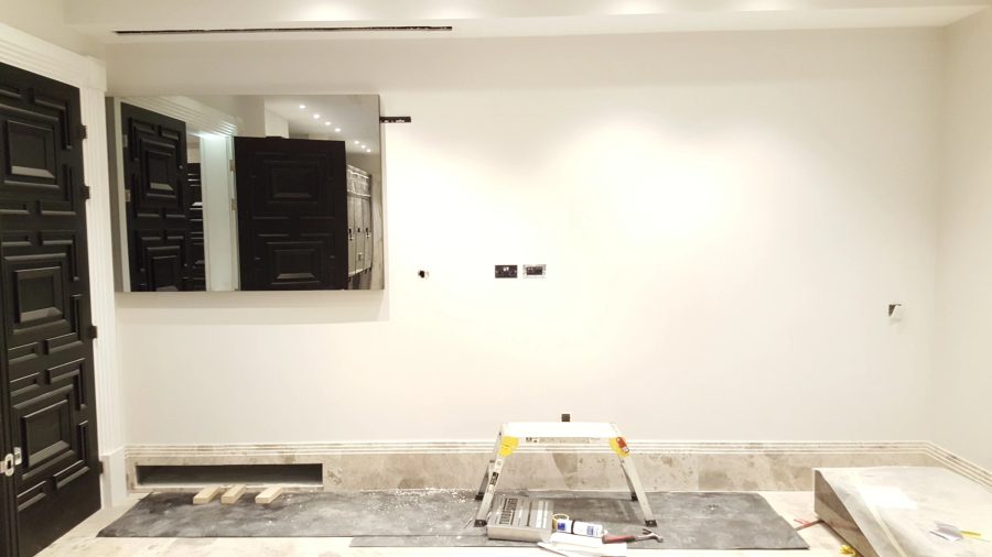 Full-Width Kitchen Mirror TV Wall — detail photograph
