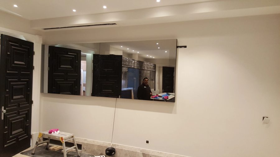 Full-Width Kitchen Mirror TV Wall — detail photograph