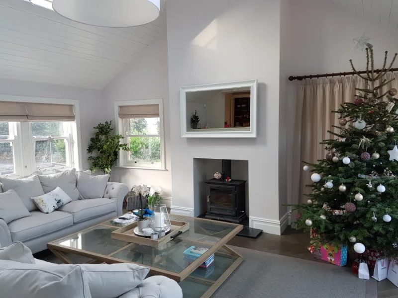 Ivory Fireplace Mirror TV — above fireplace