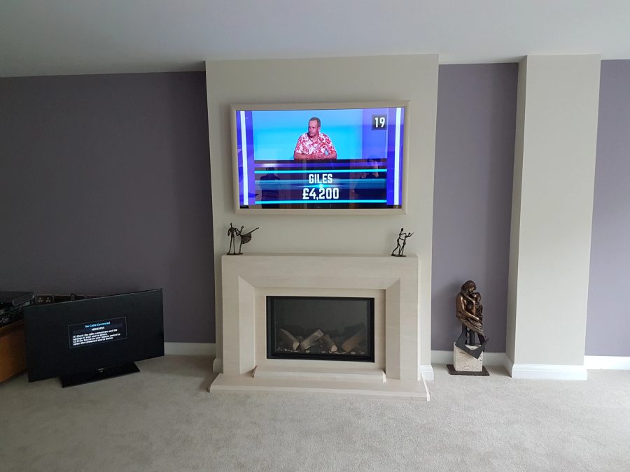 Colour-Matched Fireplace Mirror TV — above fireplace — detail photograph